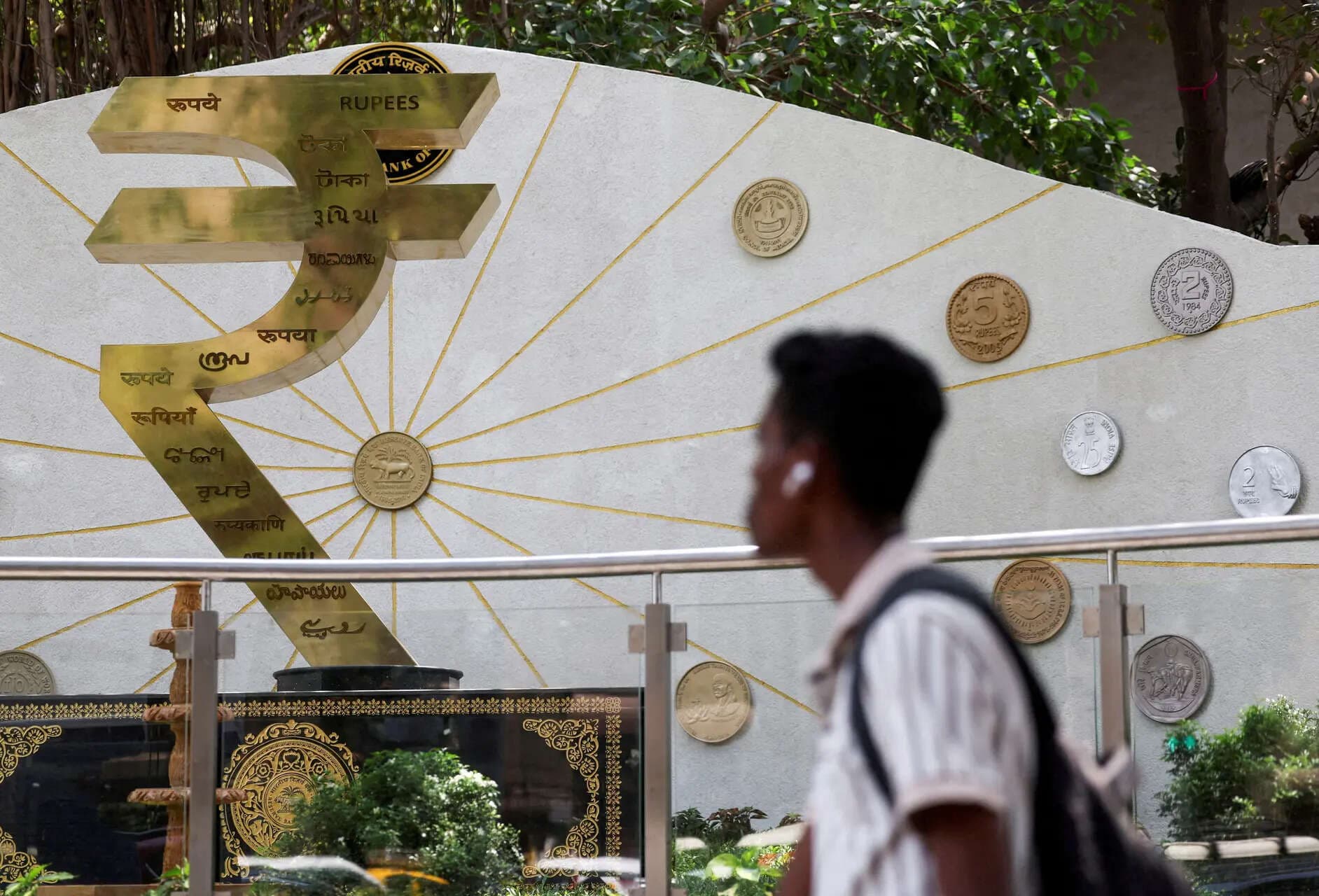 India rupee sinks to record low, US tariff pressure keeps outlook fragile