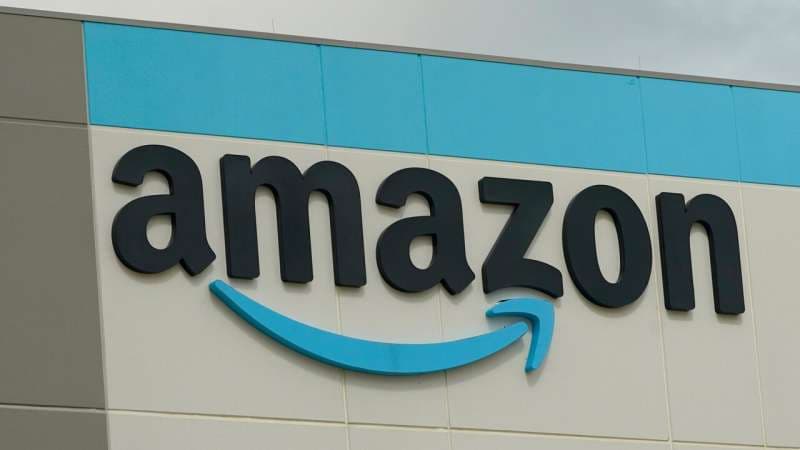 The Amazon logo is pictured at the Amazon Robotic Sorting Fulfillment Center in Madison County, Miss., Aug. 11, 2022. Credit: AP Photo/Rogelio V. Solis, File